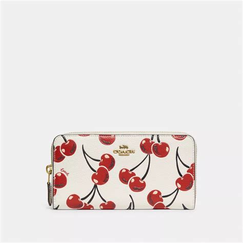 coach wallet with cherries.